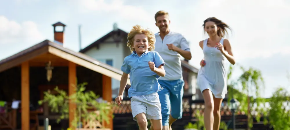 family running through lawn